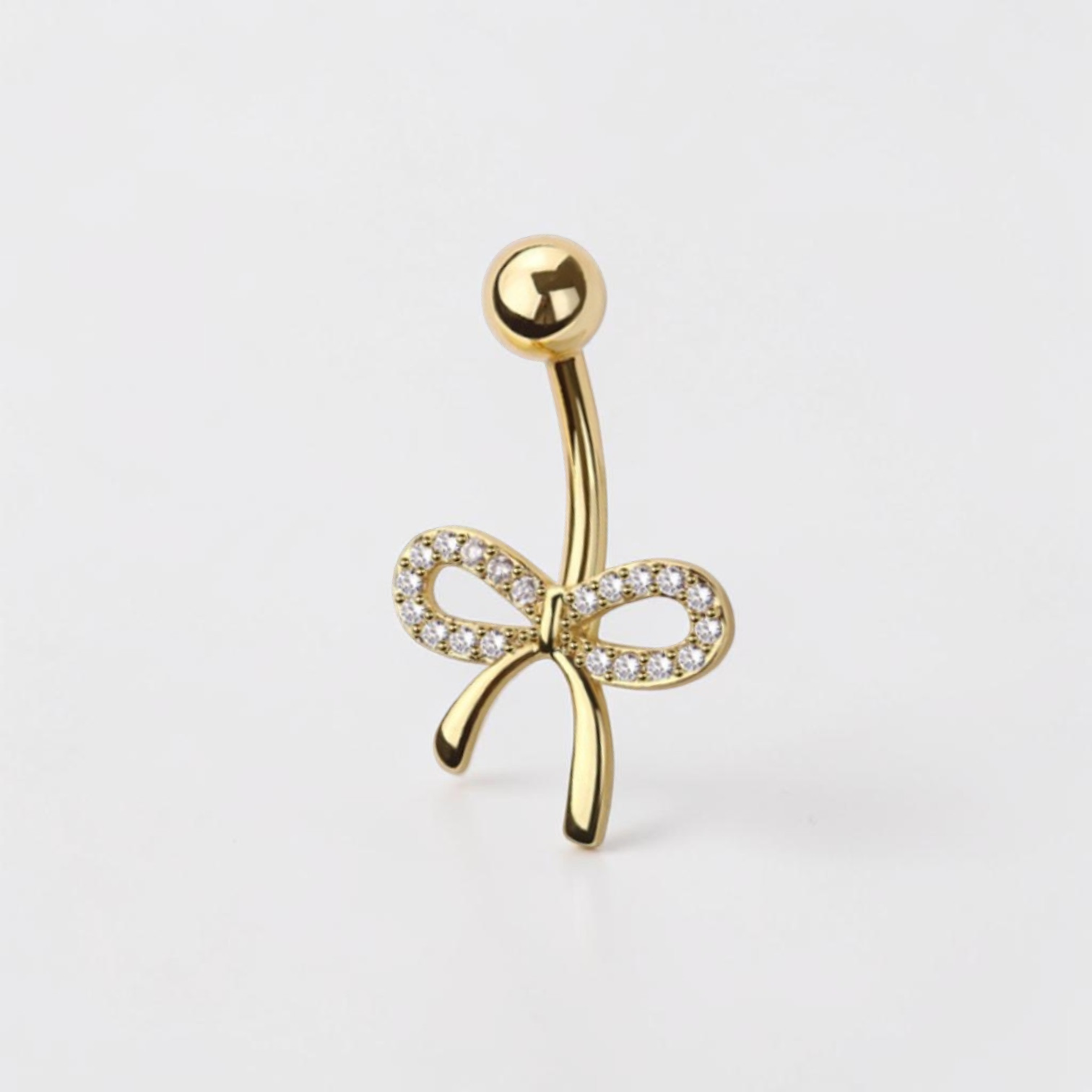 Dainty bow belly button ring with clear CZ crystals in gold finish, elegant navel piercing jewelry
