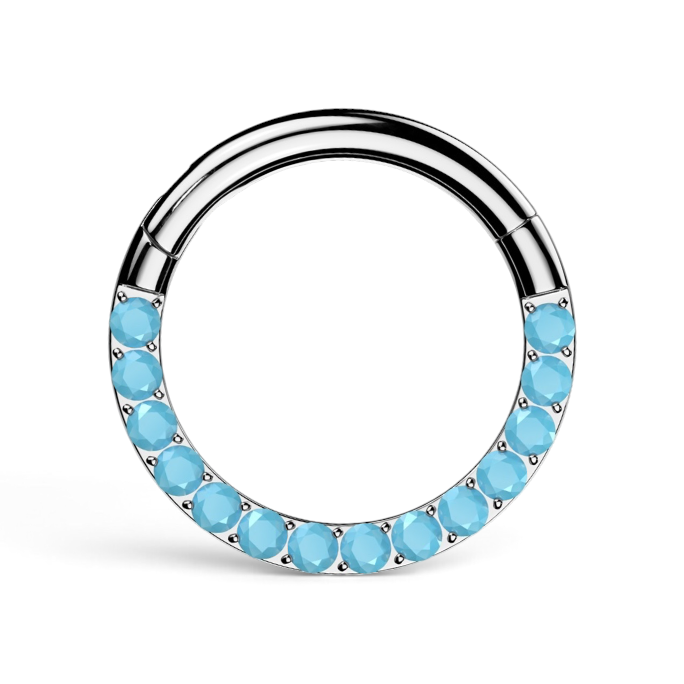 Silver daith clicker with row of turquoise-blue colored stones along the front of the hoop