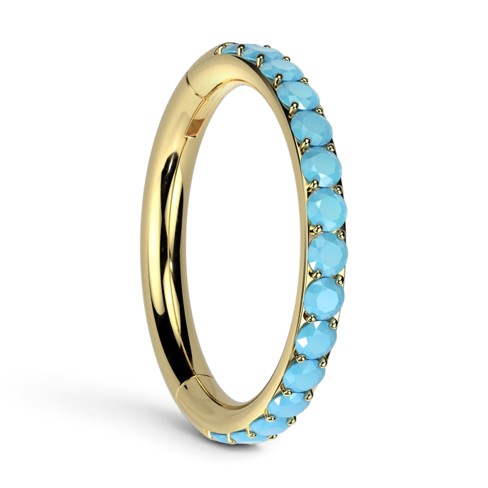 Gold cartilage hoop earring with row of turquoise-blue CZ stones