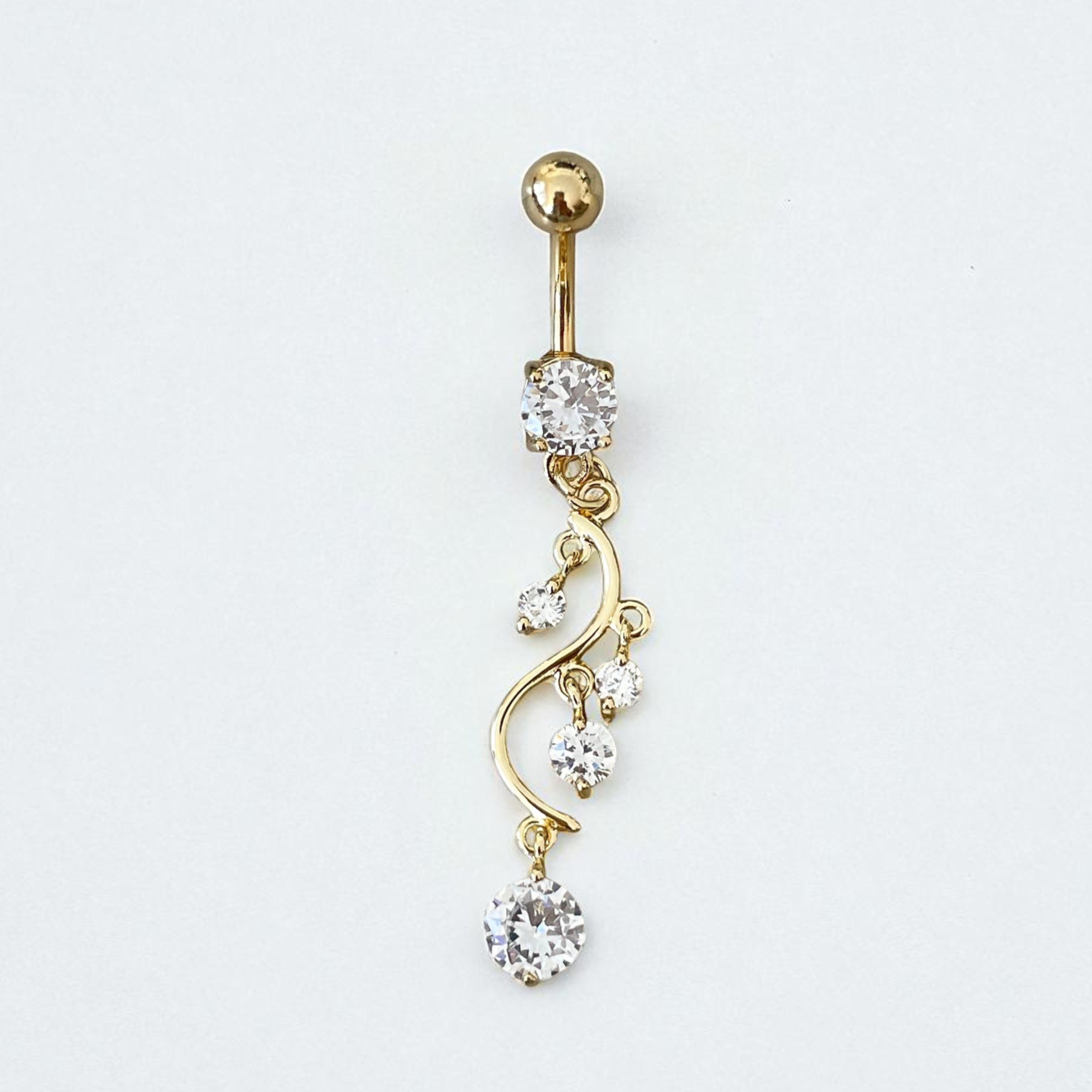 Gold belly button ring with crystal embellishments on a white background