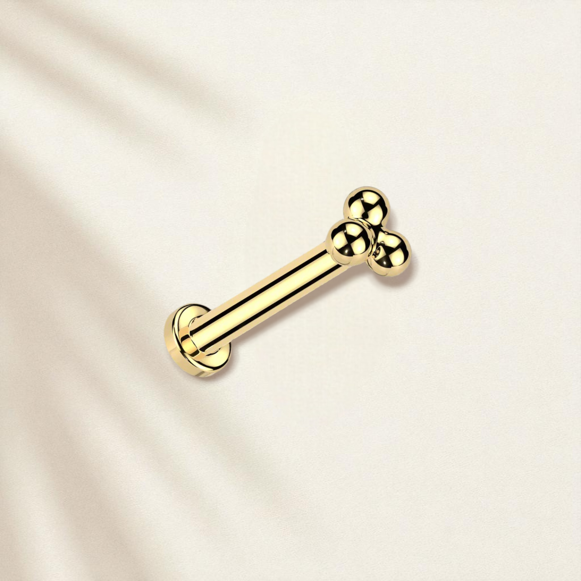 Gold stud earring with flat back, with a three bead design