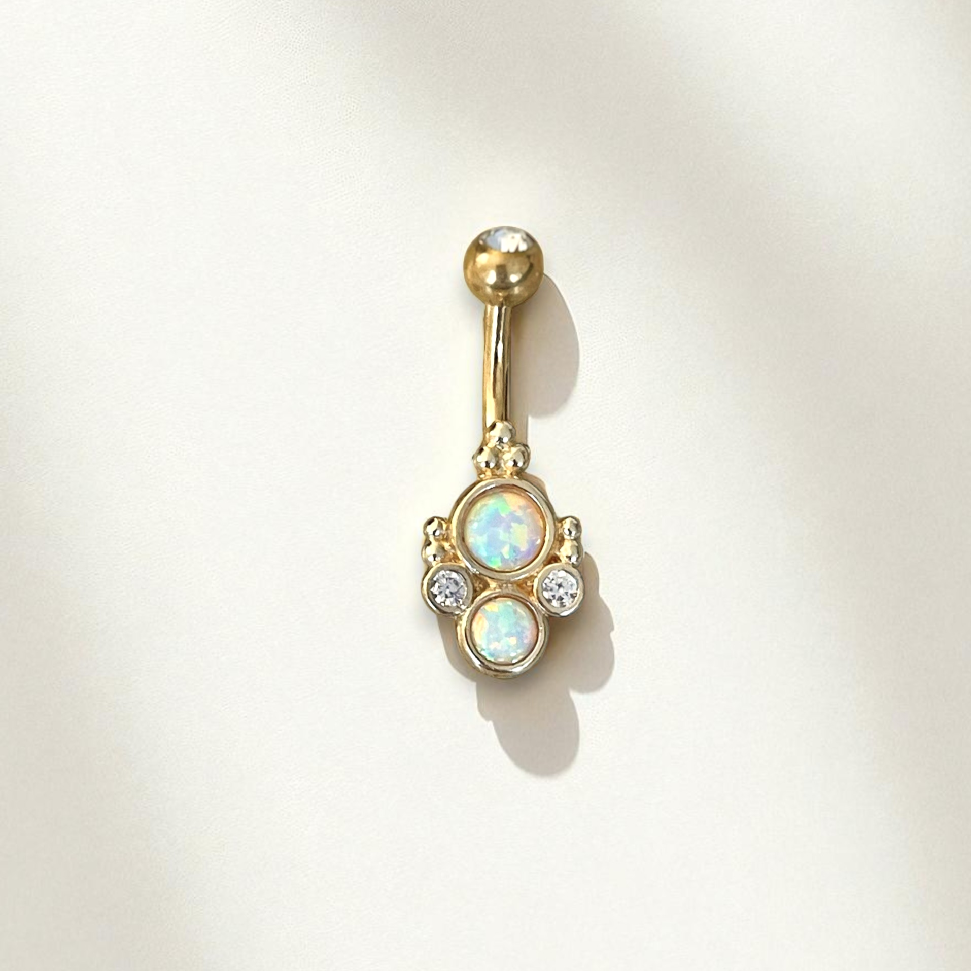 Gold belly button ring with opals