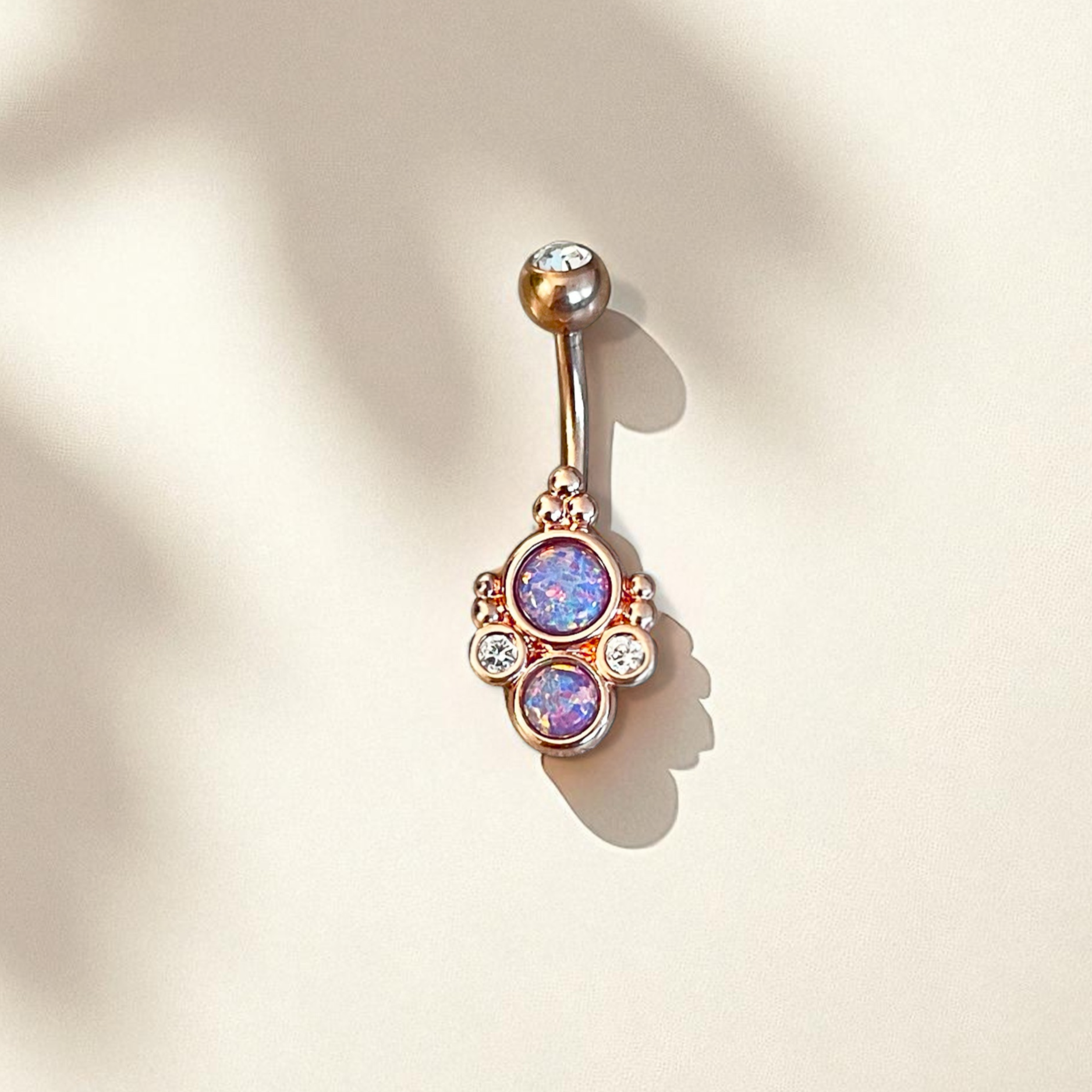Rose gold belly button ring with purple opals
