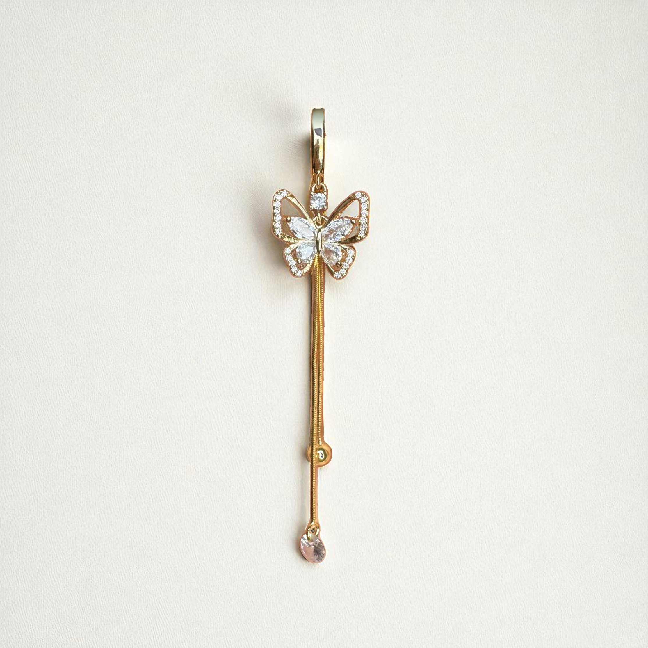 Hinged belly button ring with long gold dangly chains and a butterfly centerpiece