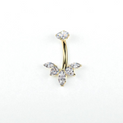 Gold belly button ring with crystal stones on a white background