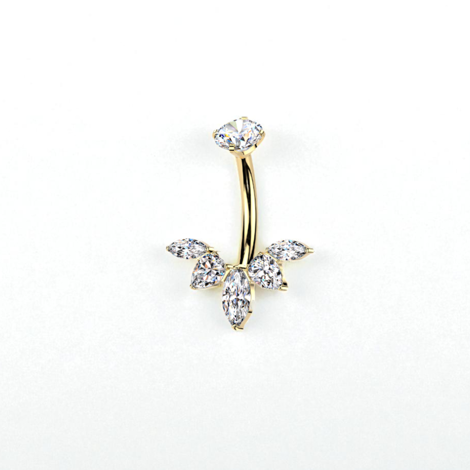 Gold belly button ring with crystal stones on a white background