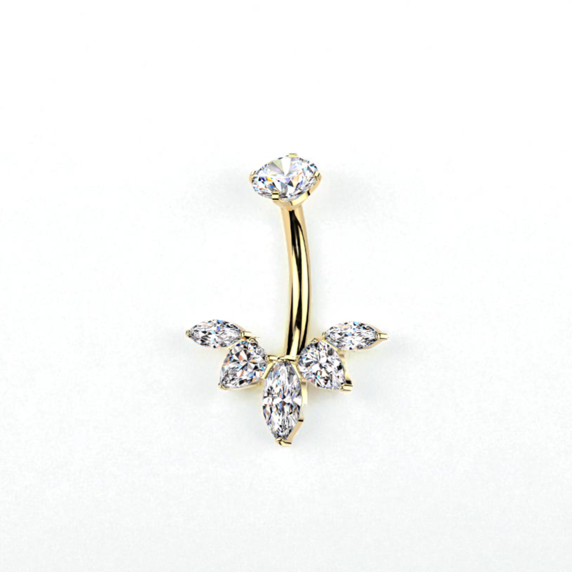 Gold belly button ring with crystal stones on a white background