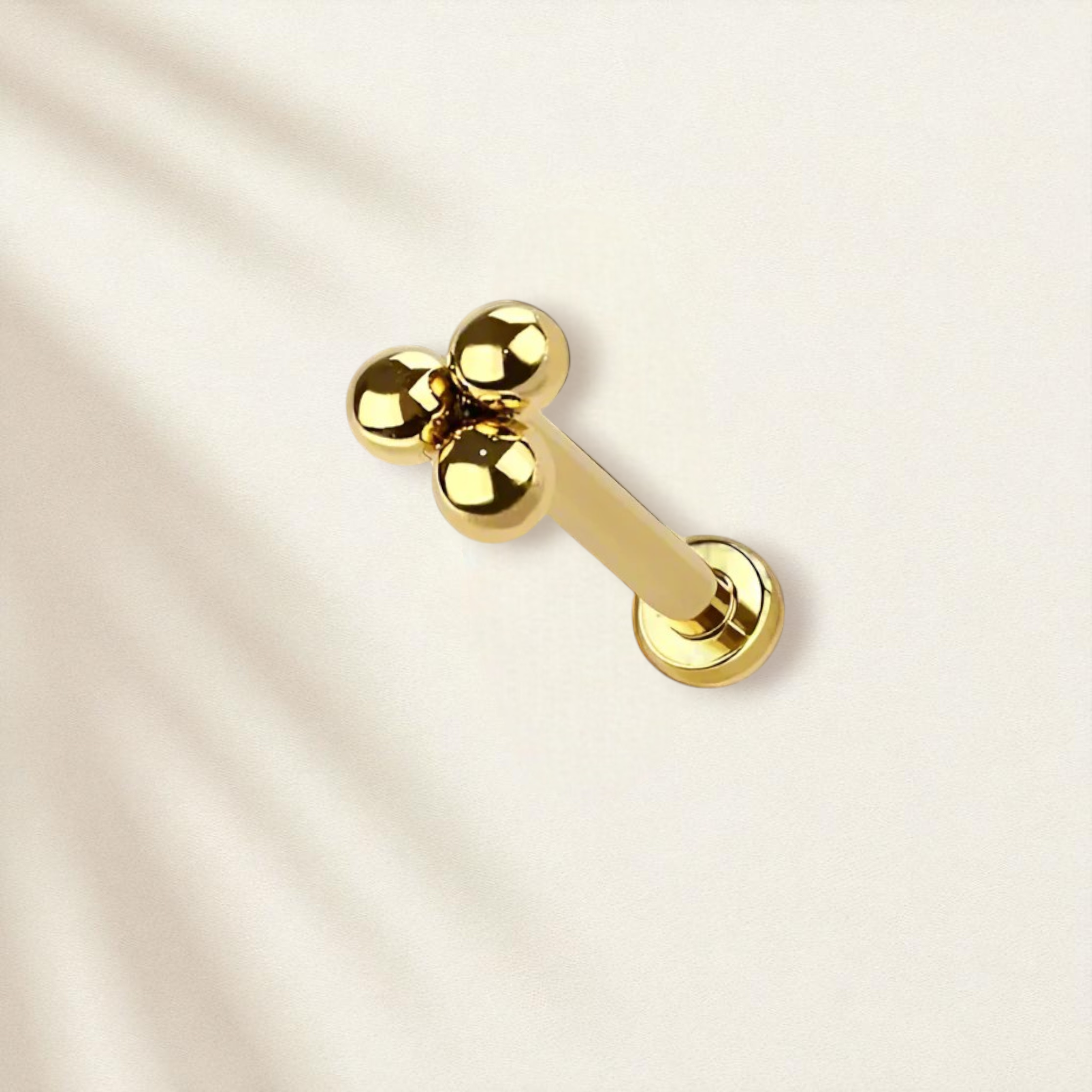 Gold stud earring with flat back, with a three bead design