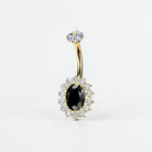 Gold titanium belly button ring with oval black CZ and halo design, internally threaded navel jewelry