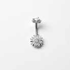 Silver belly button ring with flower-shaped top and flower-shaped bottom on a white background
