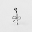 Dainty bow belly button ring with clear CZ crystals in silver finish, elegant navel piercing jewelry