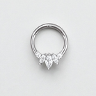 Silver nose ring with three teardrop-shaped gemstones on a light gray background