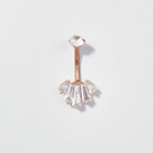 Rose gold belly button ring with clear gemstones on a light gray background