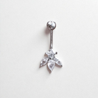 Silver belly button ring with clear gemstone designs