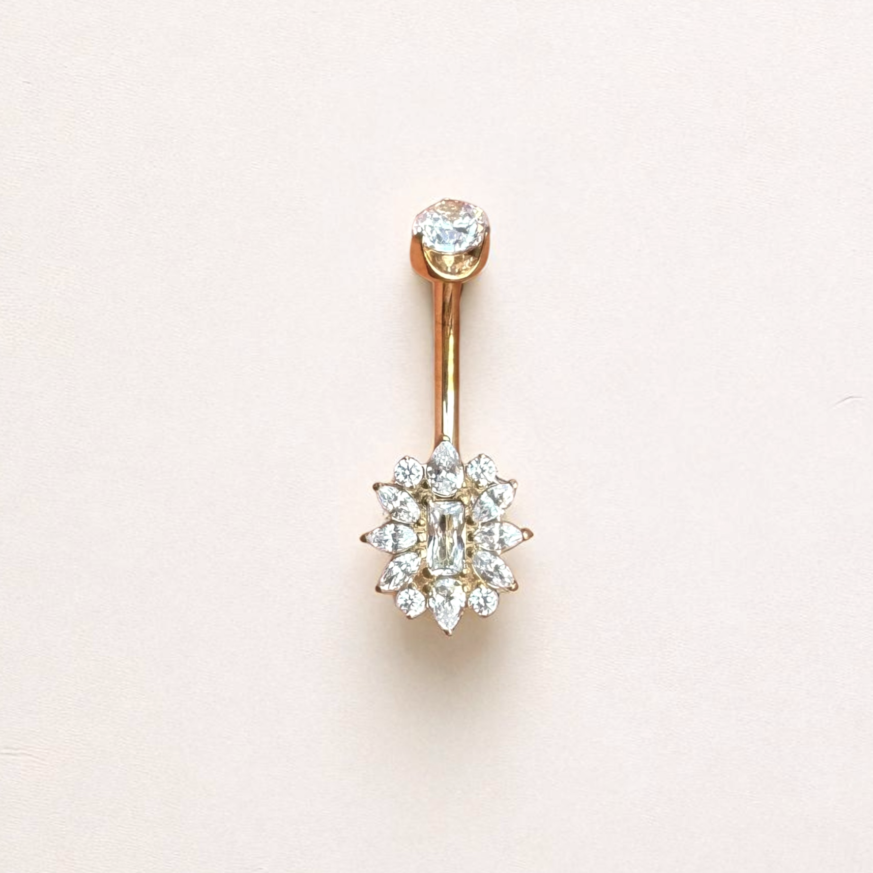 Gold belly button ring with clear gemstones