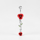 Belly button ring with red rose design on a white background
