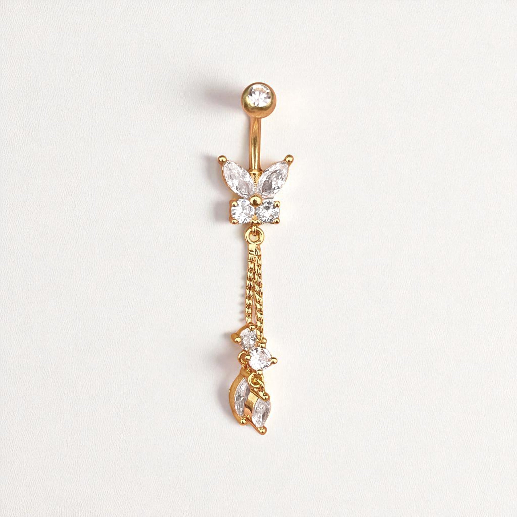Gold belly button ring with butterfly and chain design on a white background