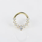 Elara Body Jewelry gold teardrop septum ring with clear CZ stones, hinged segment design.